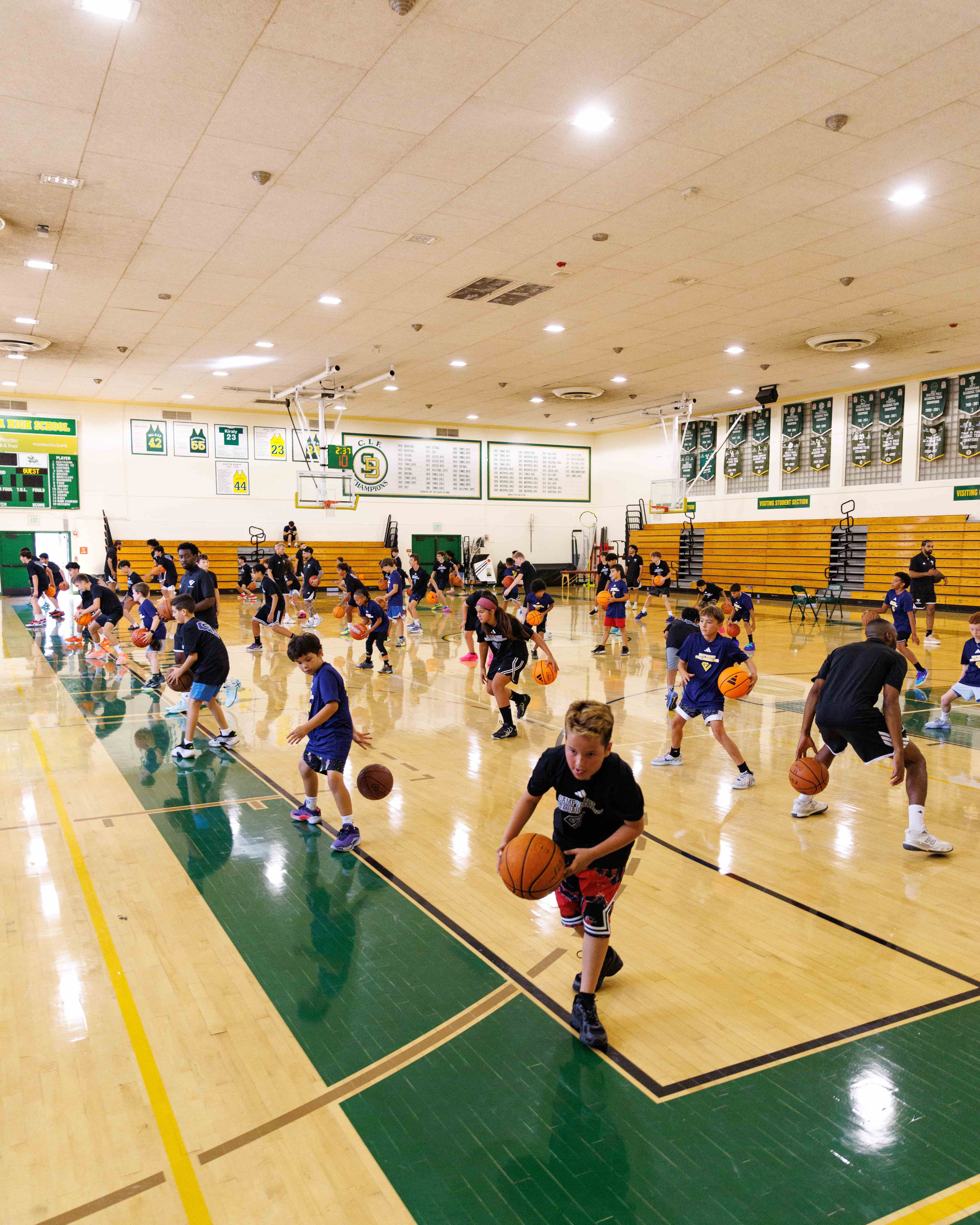 Young athletes training across the Camp Vincent gym